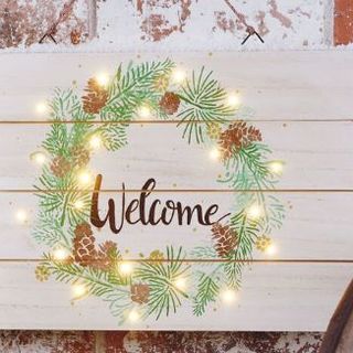 Weihnachtliches Schild mit Beleuchtung