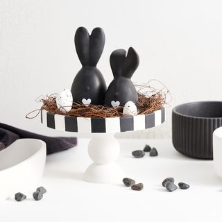 Molded decorative bowl on foot with rabbit