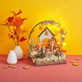 Autumnal house with illuminated decorative ring
