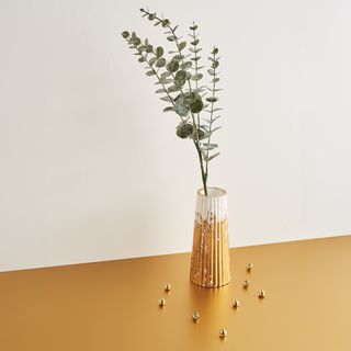 Cast decorative vase with gold leaf