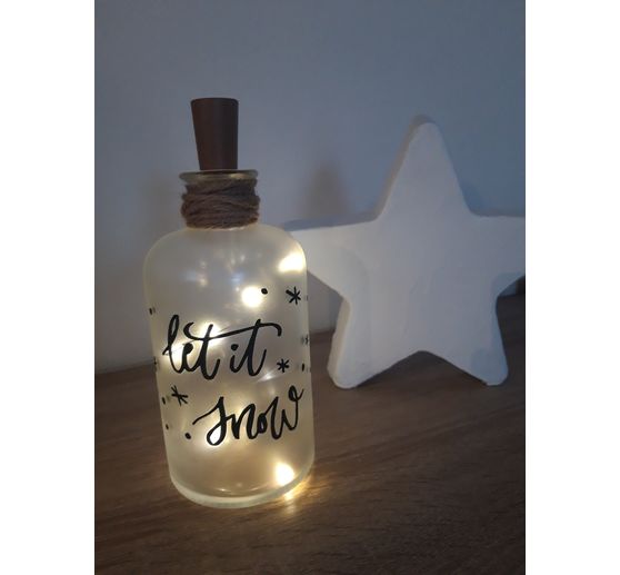 260_Nadine_Beleuchtete flasche und beton stern